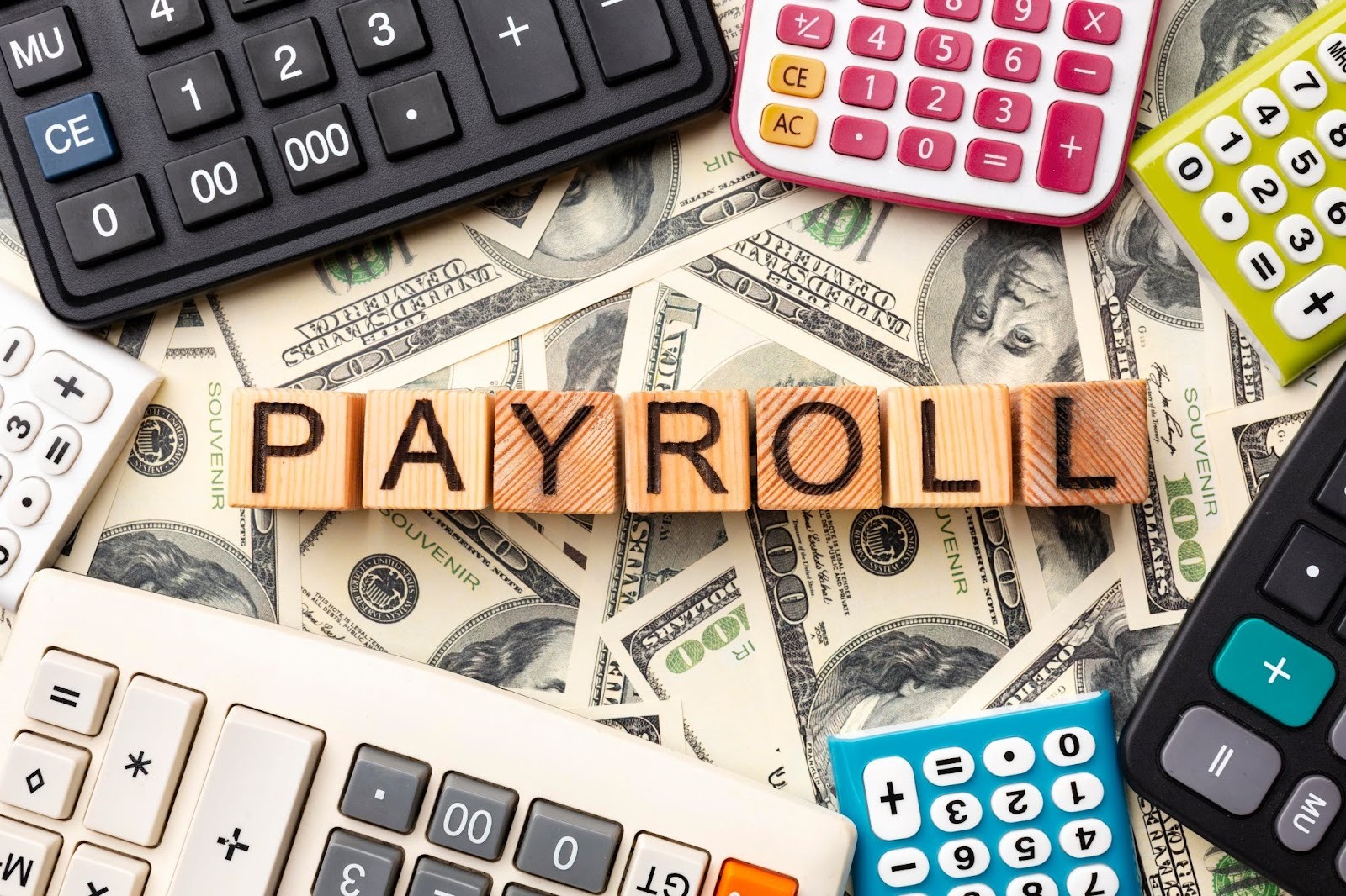 Payroll blocks with calculator and money