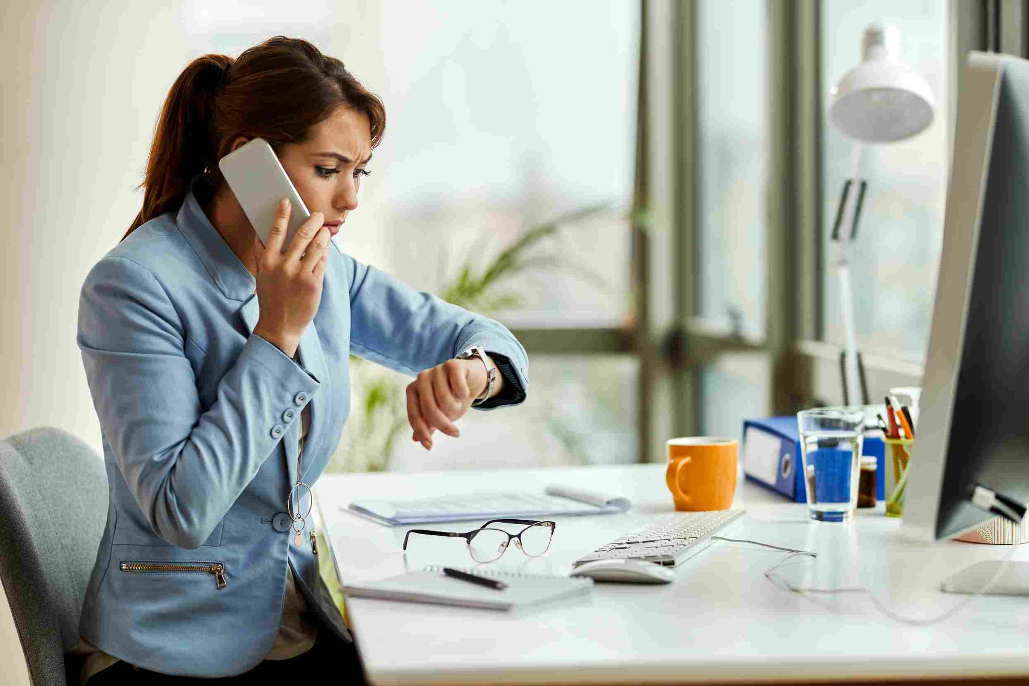 Woman checking time for payroll processing