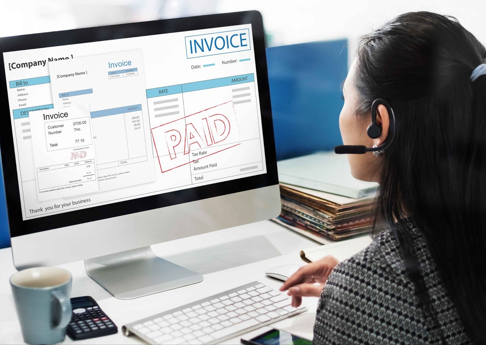 Woman looking at a computer screen showing an invoice