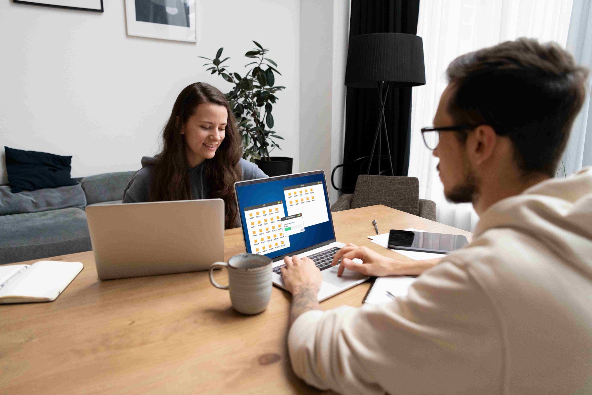 Two people looking at a laptop computer together