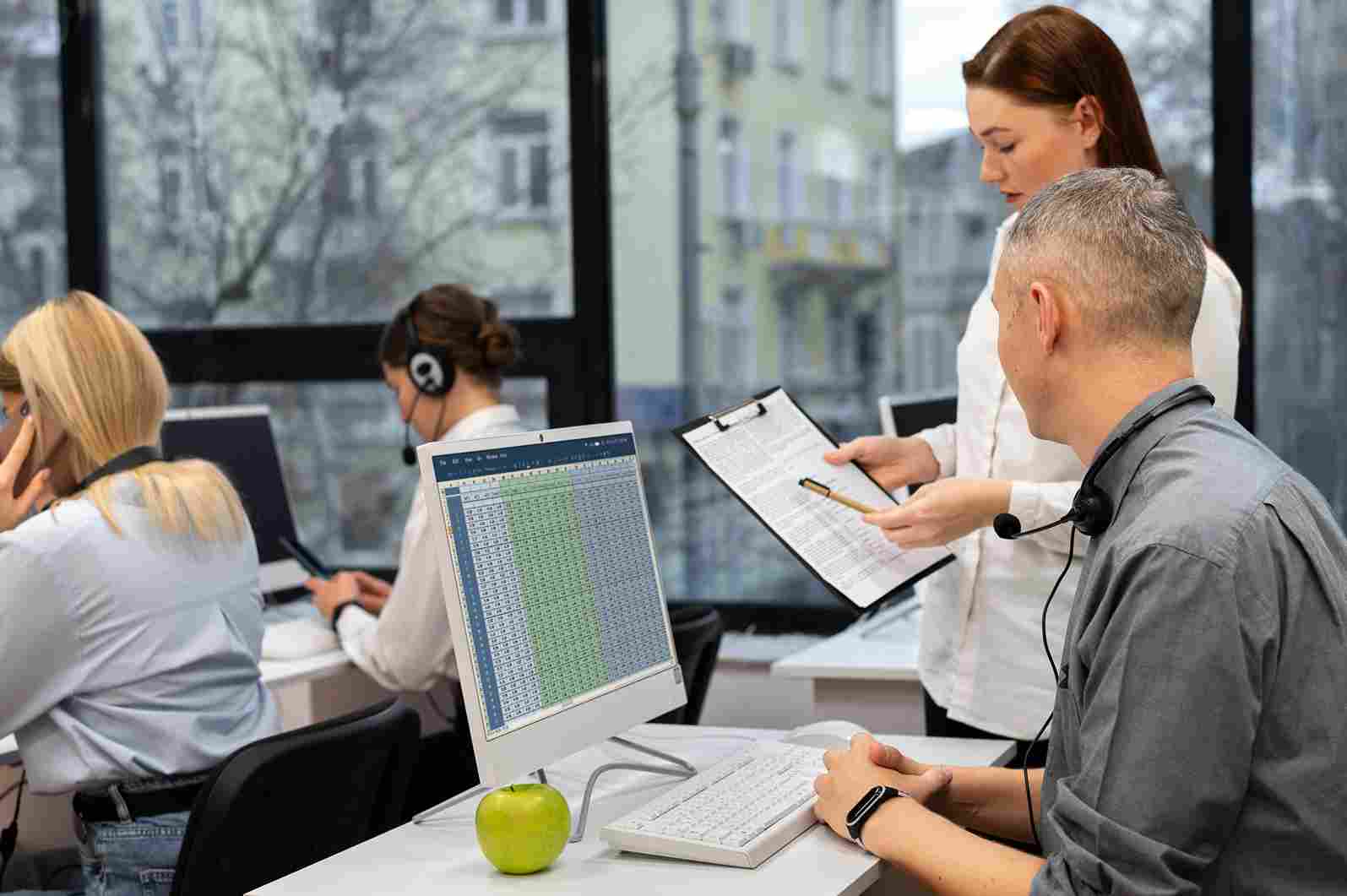 People working in a busy call center or office environment