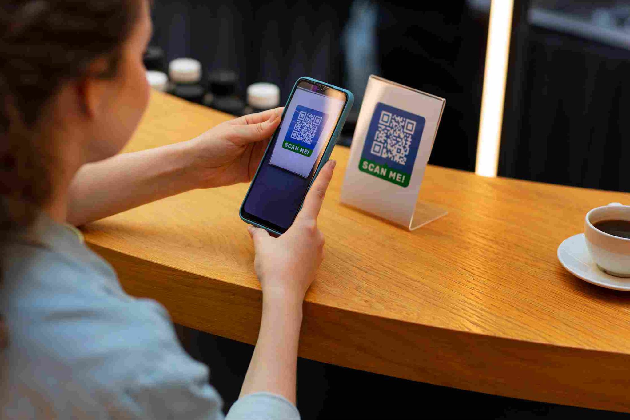Person scanning a QR code with a smartphone
