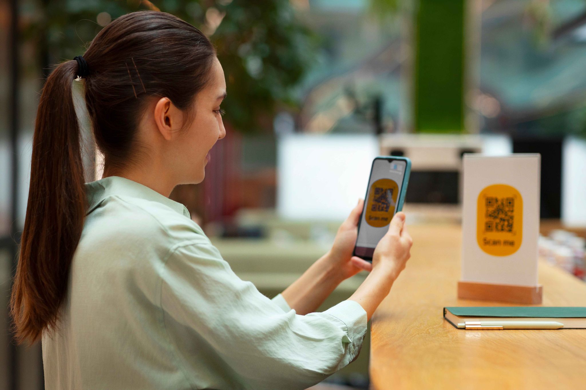 Employee scanning a QR code for time tracking