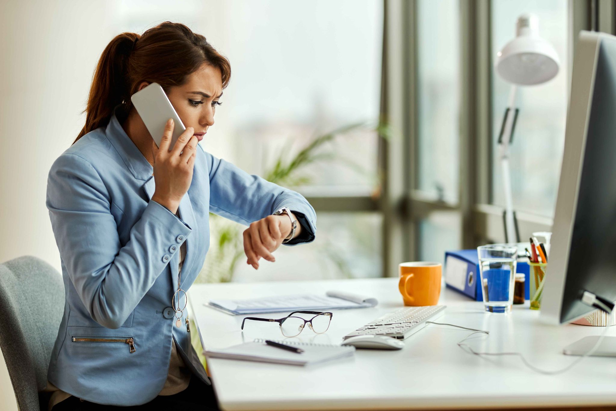 Employee checking time while managing self-service timekeeping