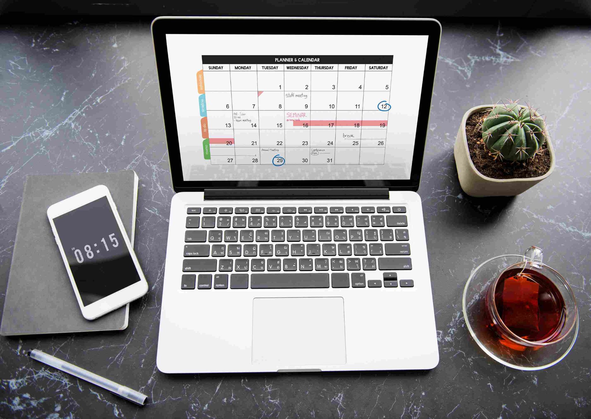 Laptop displaying a digital calendar and shift schedule
