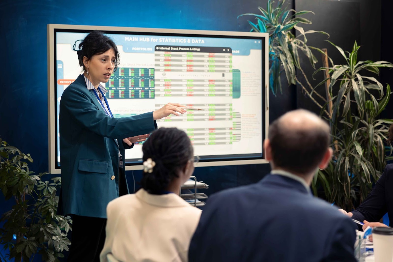 Woman presenting a schedule on a screen to a group