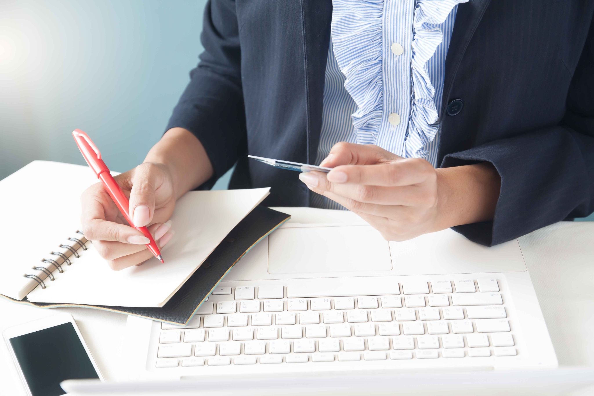 Person signing a digital document on a tablet