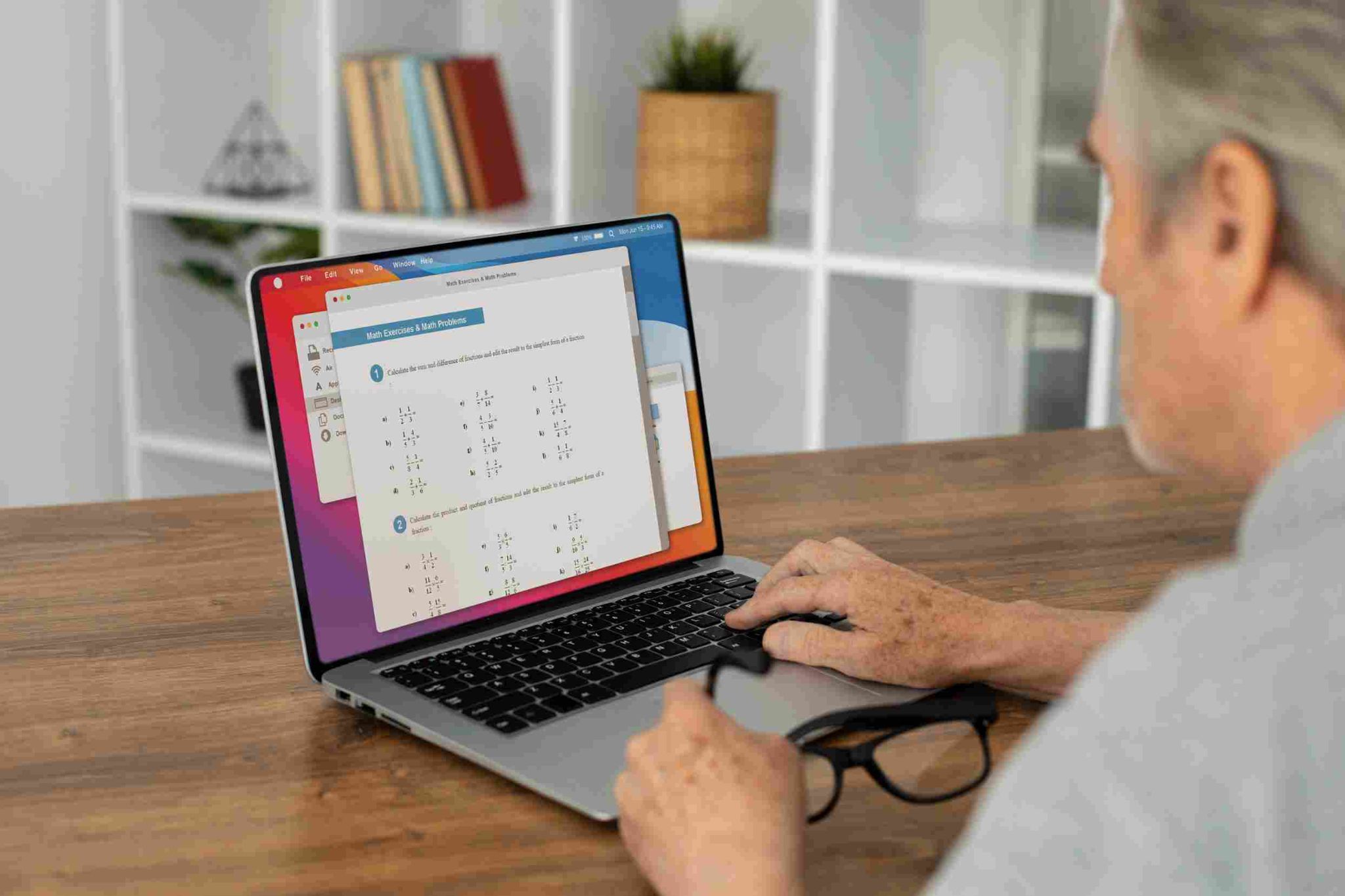 Man looking at a laptop screen with data charts