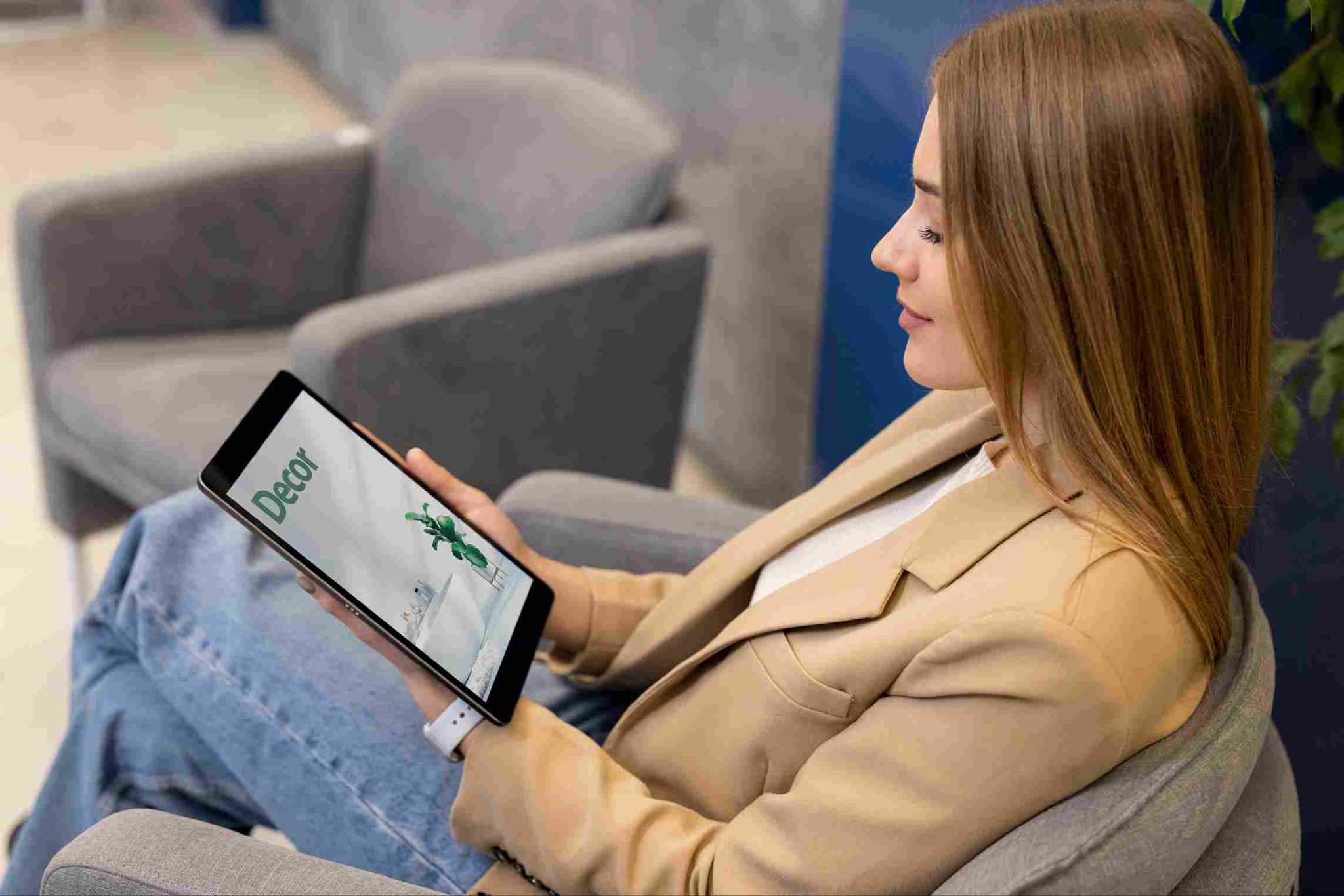 Person looking at a tablet on a couch
