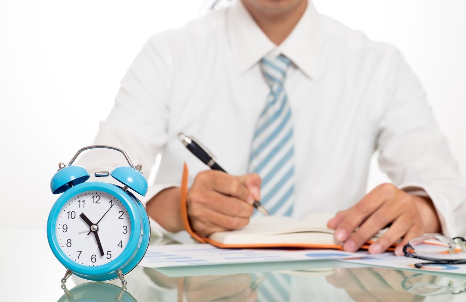 Man with alarm clock and paperwork