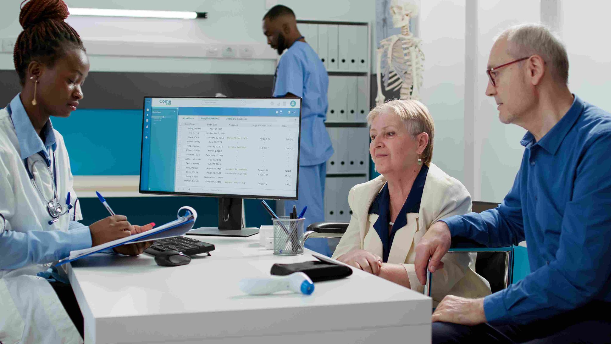 Healthcare professionals reviewing data on a computer