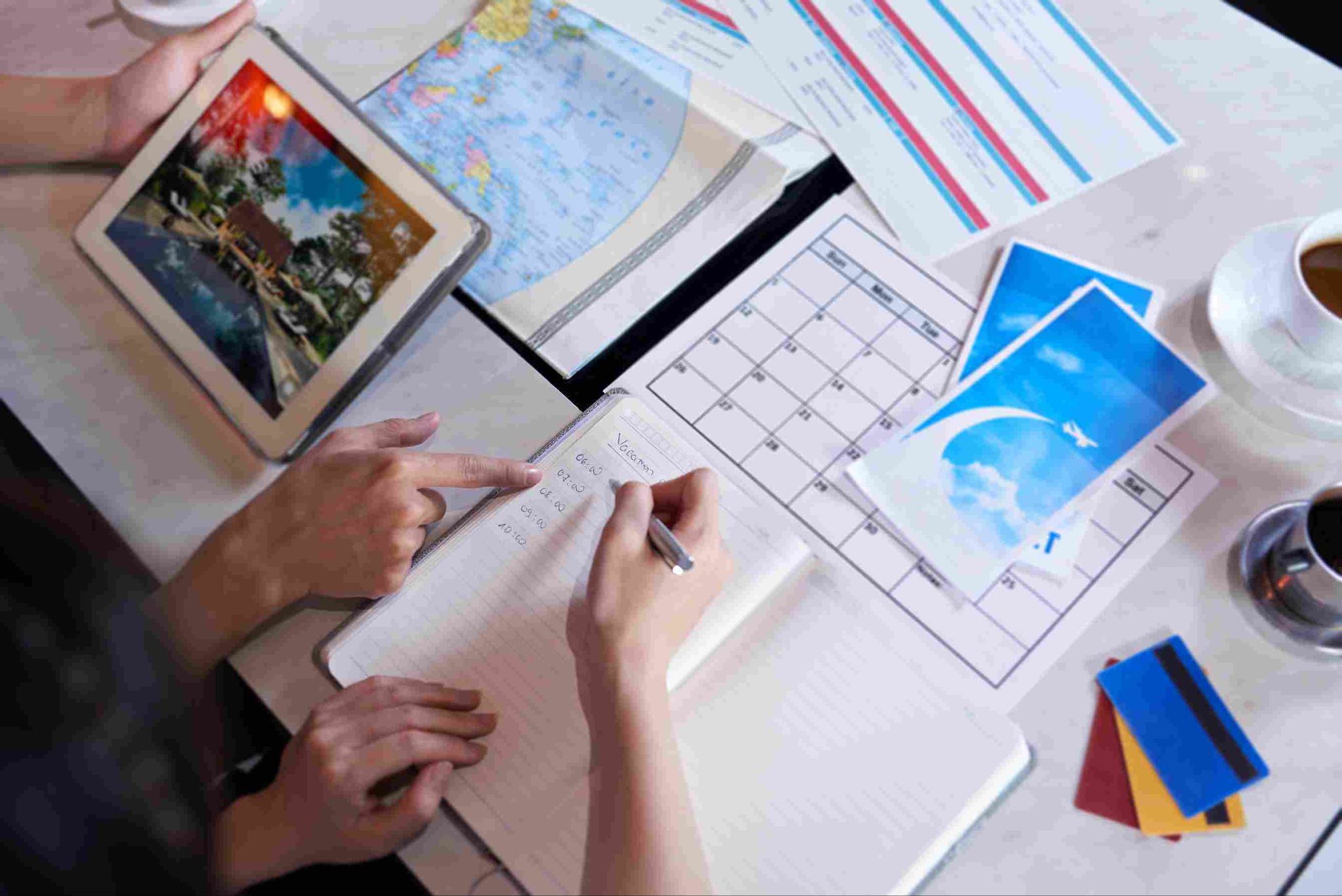 People looking at papers and tablets