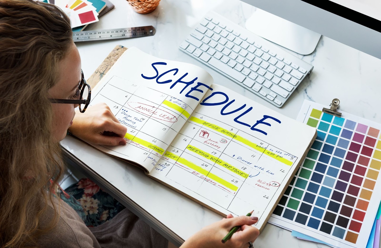 Person checking physical schedule planner