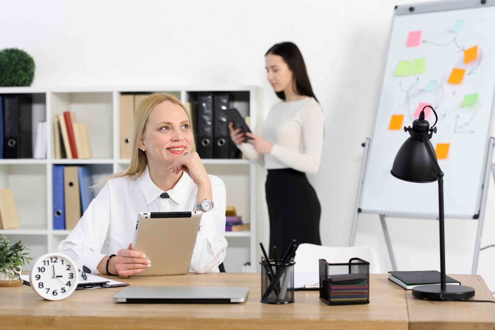 Woman working at desk using an Absence Management System