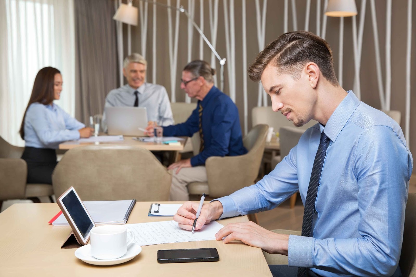 Woman working at desk using an Absence Management System