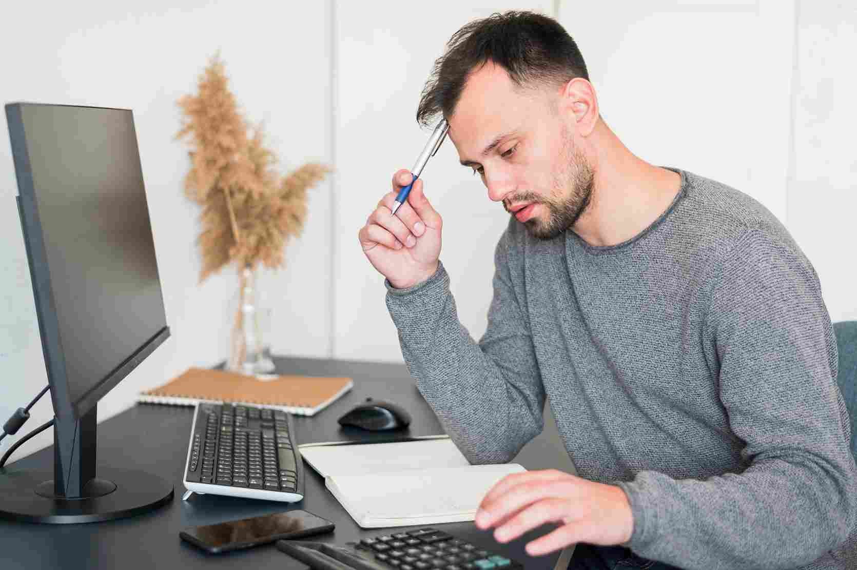 Stressed employee at computer