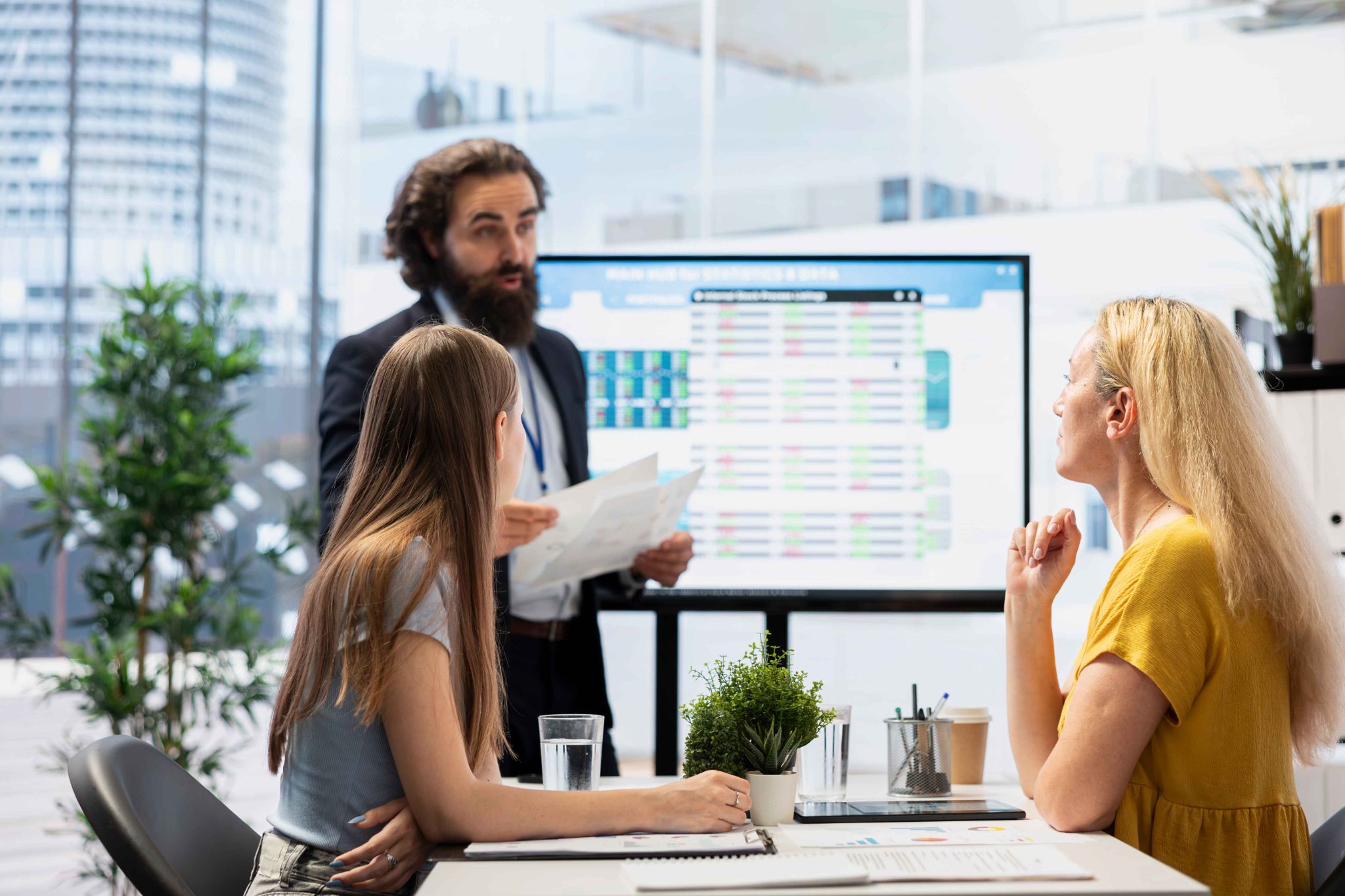 Team discussing timesheet scoring system on a screen