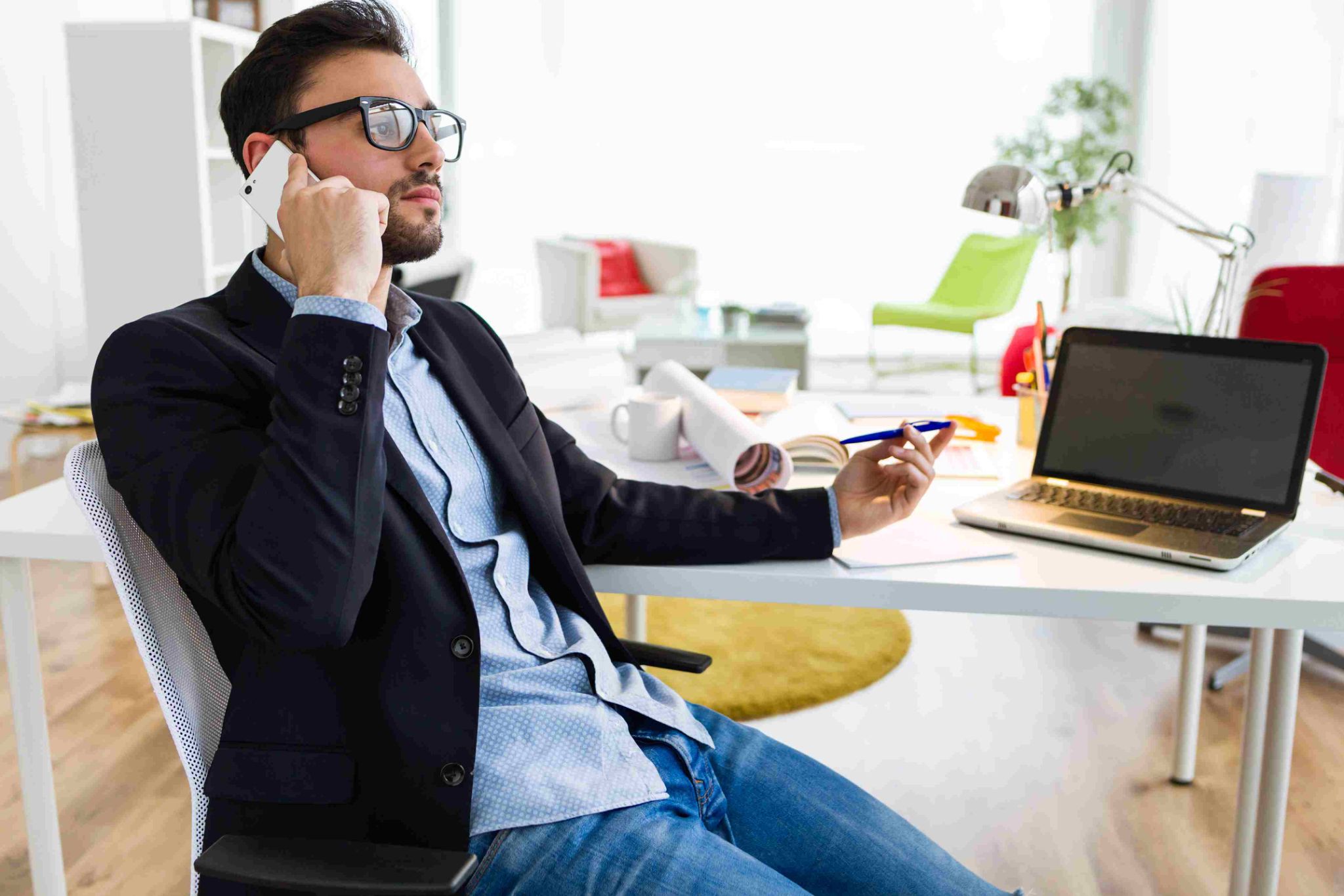 Manager on the phone reviewing attendance