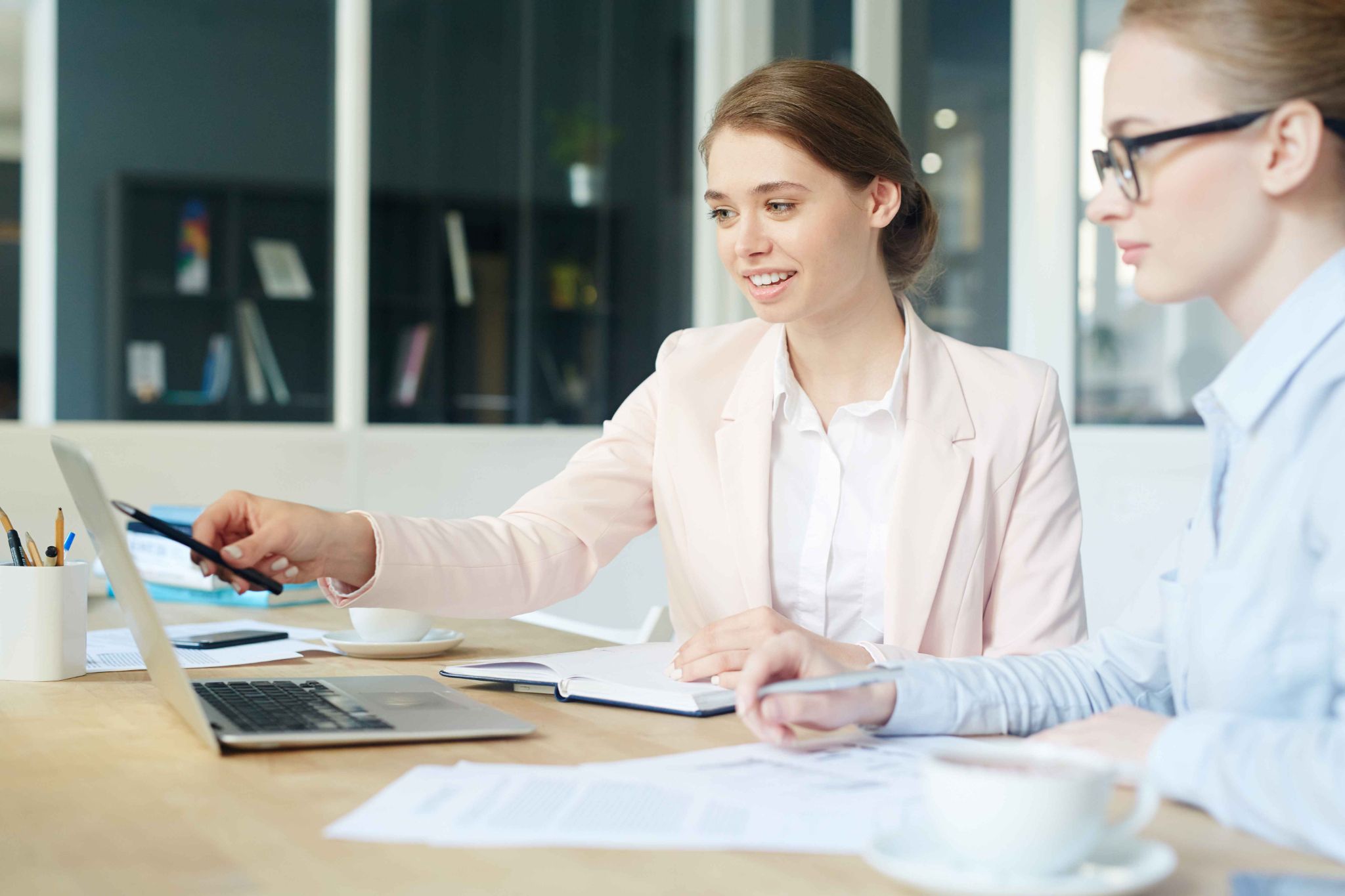 Women collaborating on payroll integration setup