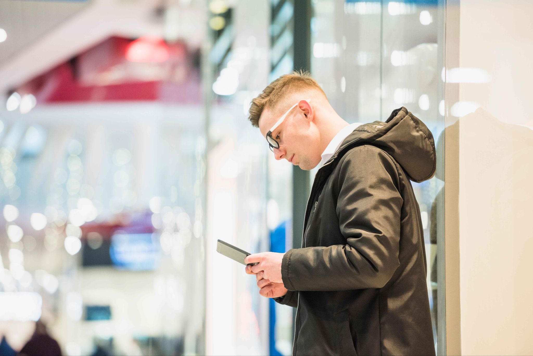Man looking at phone for time tracking