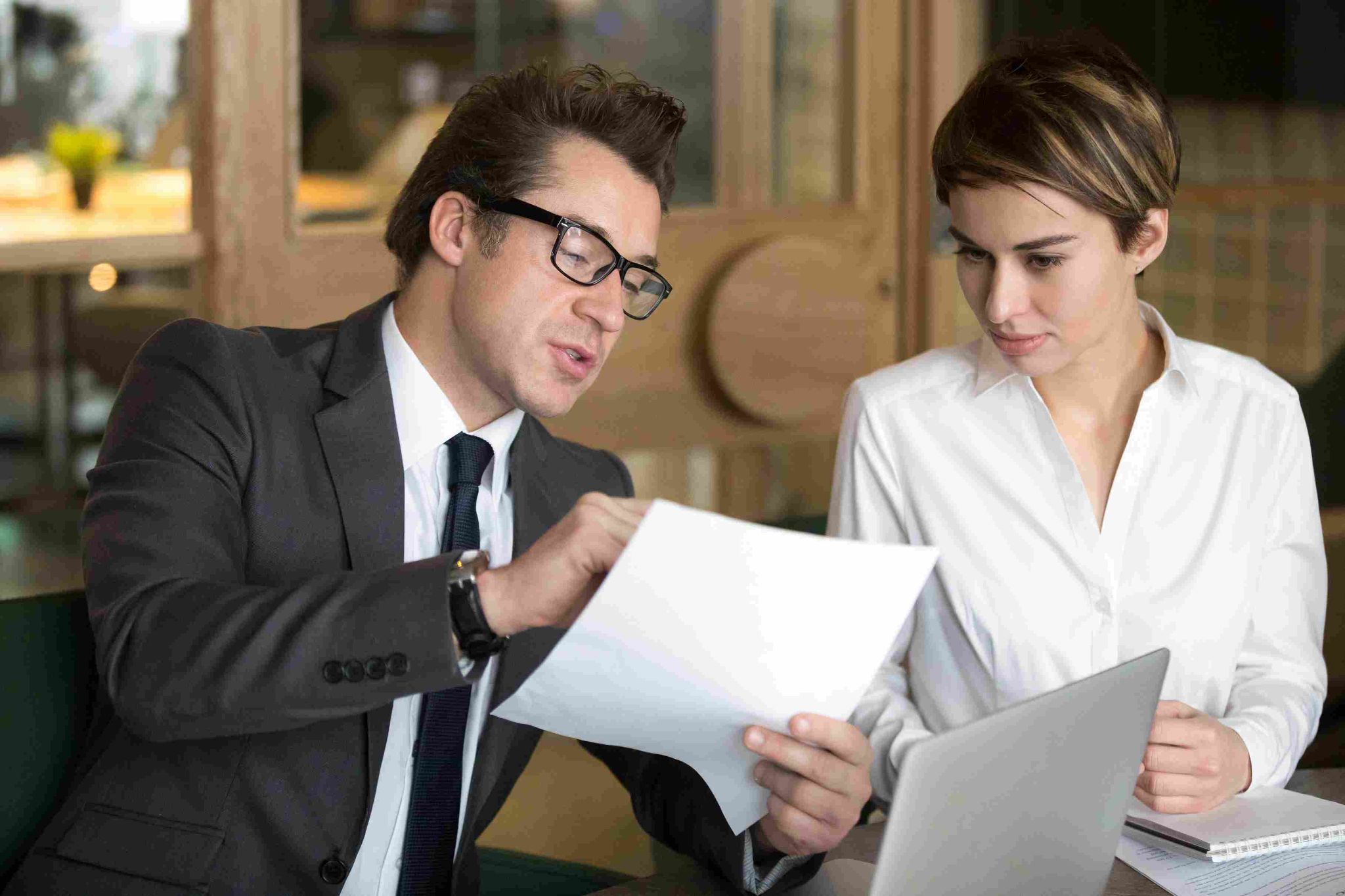 Business professionals reviewing documents